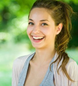 woman smiling after Wisdom Tooth Removal
